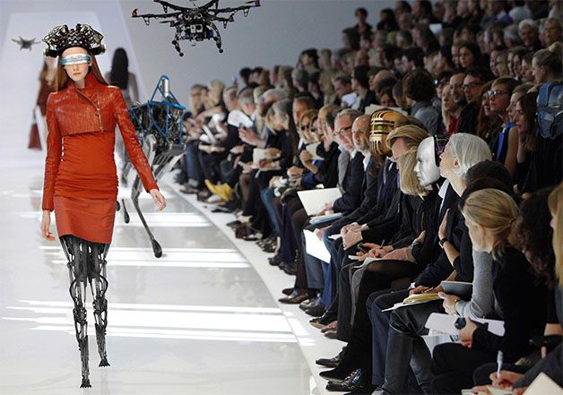 A humanoid robot model that has fallen on a fashion show runway