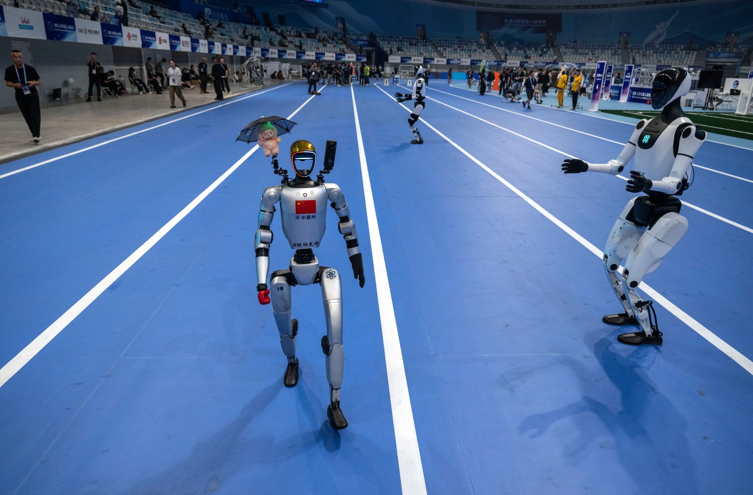 Humanoid robots competing in track events at Beijing Olympics venue