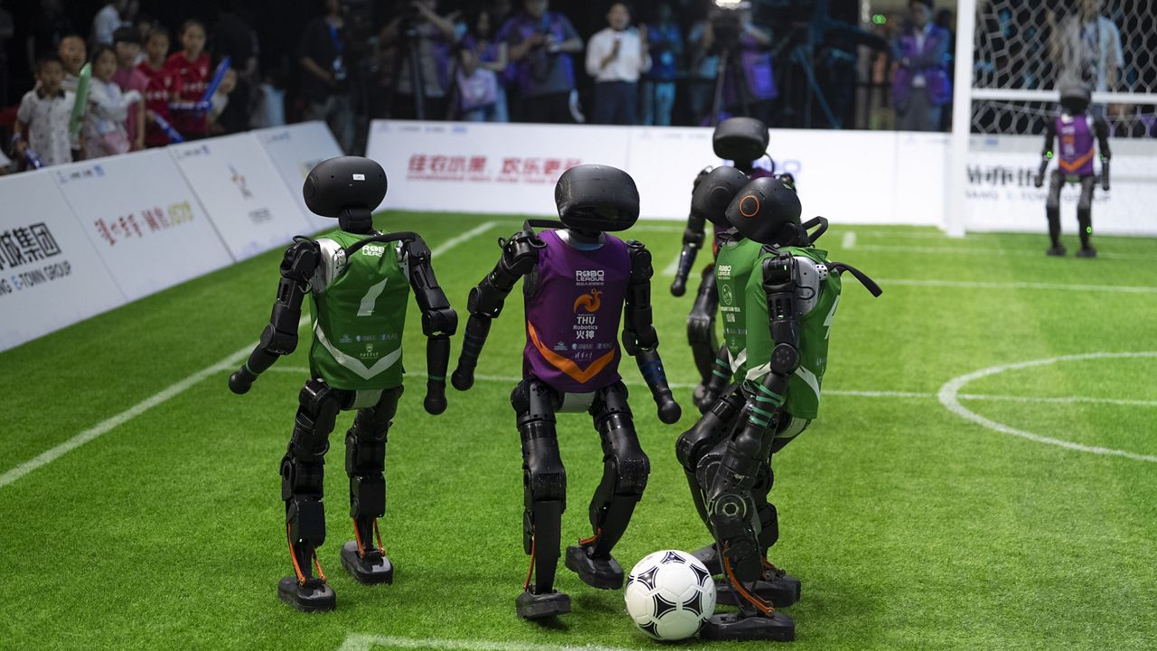 Humanoid robots playing soccer in a competition