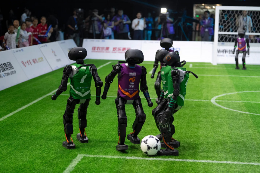Humanoid robots colliding during a soccer match